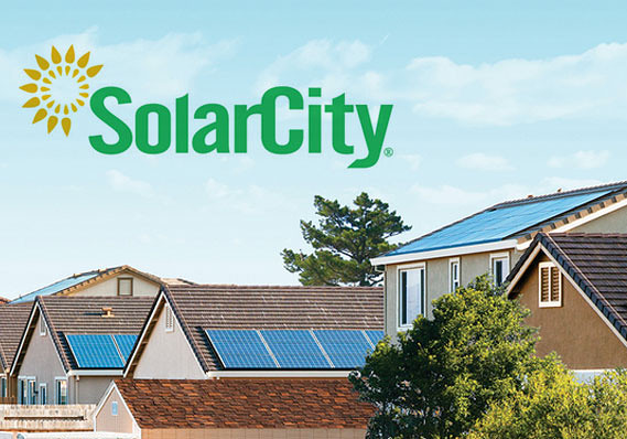 Houses with solar panels underneath the logo for SolarCity.